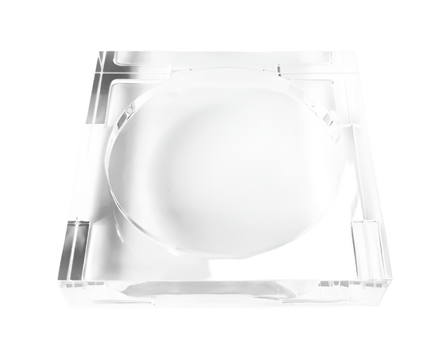 A white plate centered on a L'Avant Lucite Tray Small by L'Avant Collective against a white background.