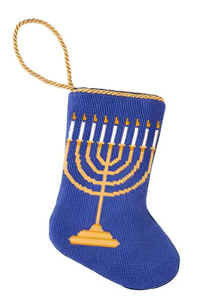 The Bauble Stockings Light the Menorah Stocking from Bauble Stockings is adorned with a gold menorah design and features a yellow braided loop, making it ideal for honoring family traditions. As part of the heirloom stockings collection, it pairs beautifully with other Bauble Stockings to create cherished holiday memories.