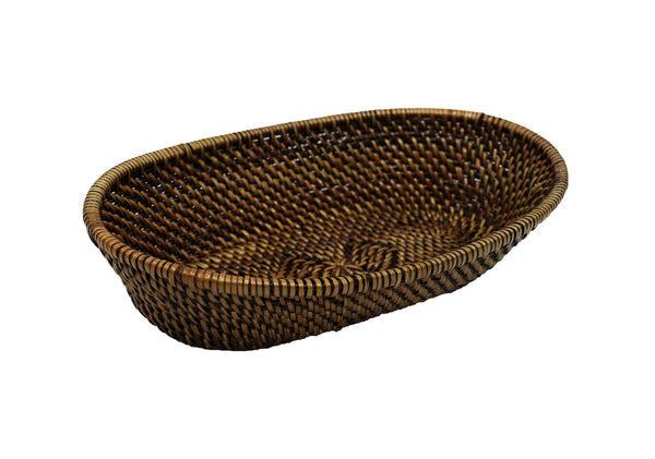 A Calaisio Oval Bread Basket with Tube Edge Collection, handmade from South Pacific water-vines with a rich brown finish, shown against a white background.