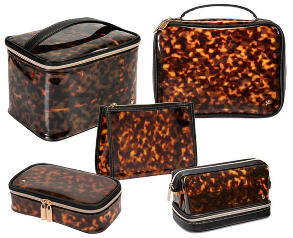 The Stephanie Johnson Miami Tortoise Travel Collection features five sleek tortoiseshell-patterned travel organizers with zip closures and a glossy finish, beautifully displayed on a white background.