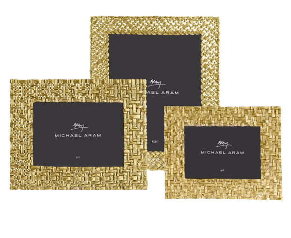 Three Michael Aram Palm Frame Collection picture frames, each in different sizes (4x6, 5x7, and 8x10), featuring a gold finish and intricate palm designs, are displayed against a white background. The sculpted textures of these Michael Aram frames add elegance to the collection.