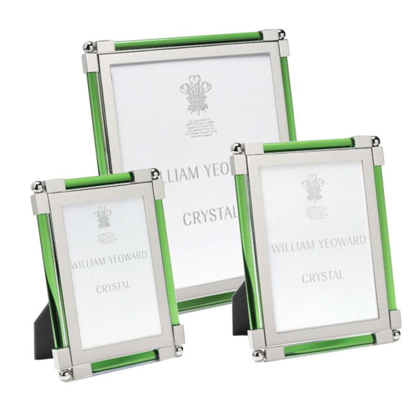 Three classic photo frames of varying sizes, from the William Yeoward Classic Frame, Moss Green Collection by William Yeoward Crystal, featuring green edges with silver corners and nickel-plated finishes to ensure a tarnish-free shine.