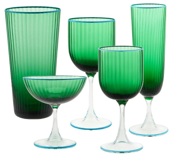 The Aquazzura Murano Striped Green Collection by Aquazzura Casa is a set of five handblown pieces made in Italy, including a tall tumbler, a coupe glass, and three wine glasses. Each piece features green-tinted vertical ribbing with clear stems.