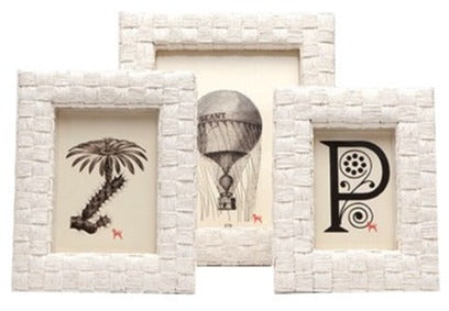 Three Pigeon & Poodle Nassau White Rope frames containing illustrations of a palm tree, a hot air balloon, and an ornate letter p.