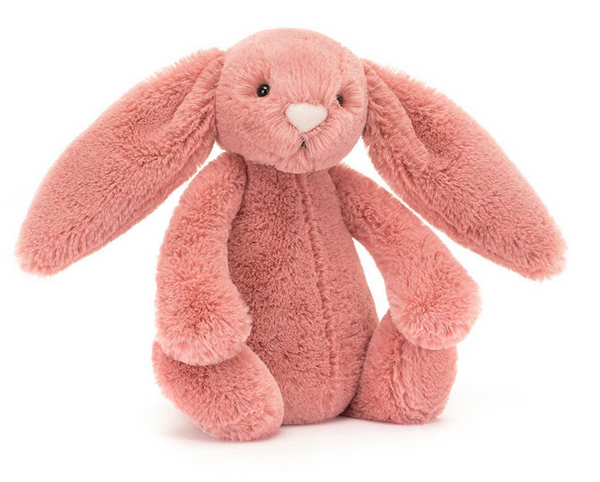 A soft and pink bunny toy with long ears and a fuzzy texture, the Jellycat Bashful Sorrel Bunny, Small is a timeless gift perfect for cuddles and play.