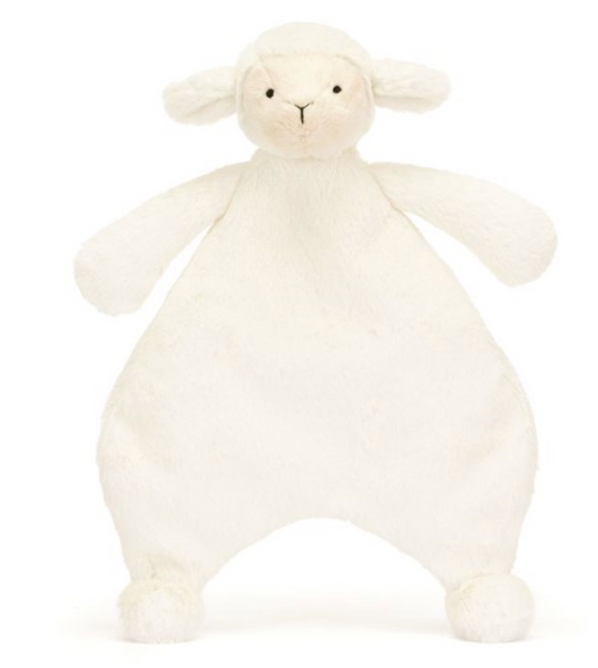 The Jellycat Bashful Lamb Comforter is a white plush toy shaped like a sheep with a round head, small black eyes, and floppy ears. Perfect as a newborn gift, its body is flat and wide with small paws at the ends of its limbs, all crafted from recycled fibers.