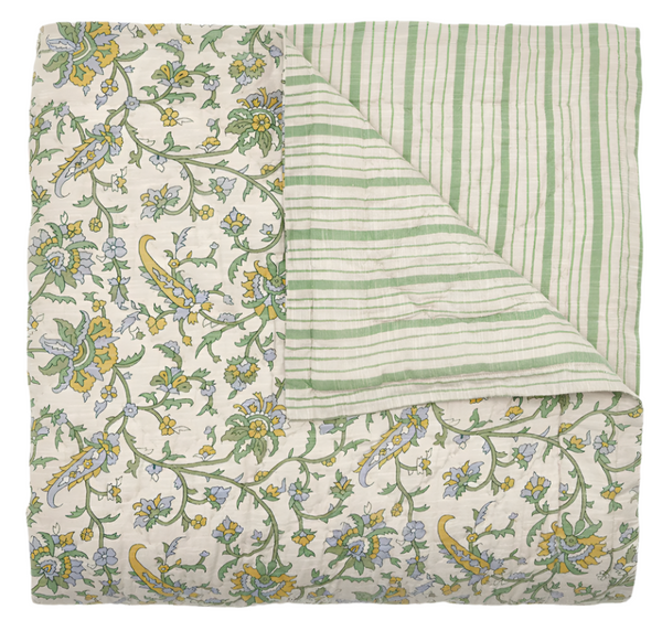 The John Robshaw Tiya Periwinkle King Quilt is a hand-quilted blanket that showcases a floral pattern on one side and green stripes on the other, crafted from soft cotton fabric.