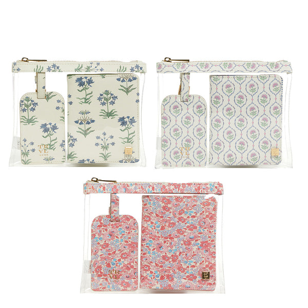 The TRVL Design Luxe Saffiano Travel Set features three transparent pouches, each with two smaller floral-patterned pouches arranged in a grid, perfect for organizing essentials and ideal for any travel gift set.