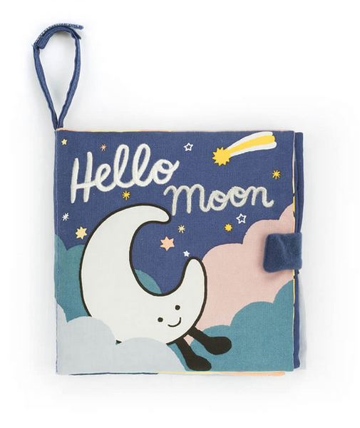 A children's interactive fabric book titled "Jellycat Hello Moon Fabric Book" by Jellycat features an illustration of a smiling crescent moon, clouds, and a shooting star on the cover. The baby exploration book comes with a blue fabric handle and closure.