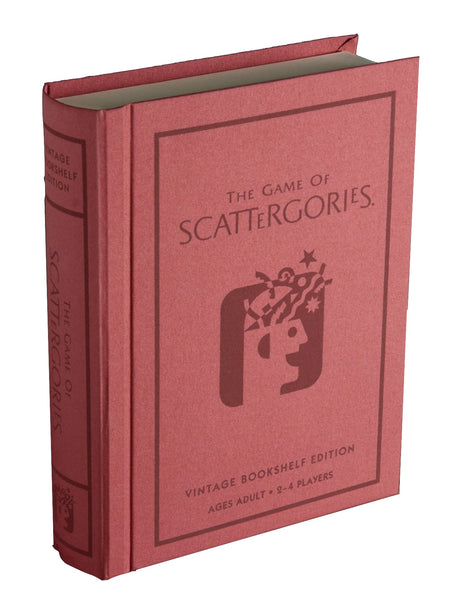 A pink hardcover book resembling "Scattergories Vintage Bookshelf Edition" by WS Game Company, complete with the iconic timer and vintage SCATTERGORIES design on the cover.