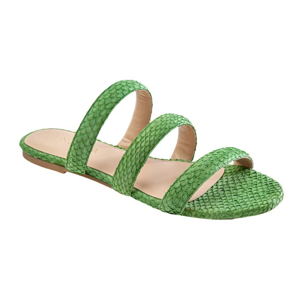 The Nayla Mimi Sandal by Nayla is a green strappy flat sandal with a textured surface and three straps, perfect for brightening up outfits from dresses to denim. The open toe design adds a chic touch.