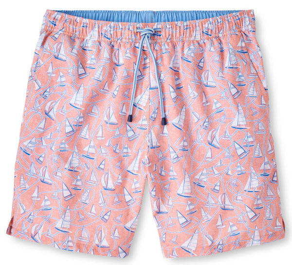 The Peter Millar Boats and Ropes Swim Trunk features a light pink shade with a blue and white sailboat pattern, an elastic waistband, and a drawstring tie. Made from quick-drying fabric, these swim trunks ensure you stay comfortable both in and out of the water.