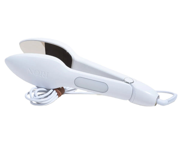 The Nori Press Steam Iron by Nori Inc features a coiled power cord and "Nori" engraving. This compact travel hair straightener delivers sleek results for on-the-go styling.