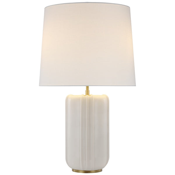 The Minx Large Table Lamp by Visual Comfort features a white ceramic base with mid-century charm, complemented by a beige fabric shade. Perfectly suited for both modern and traditional rooms, it adds a touch of elegance to any space.