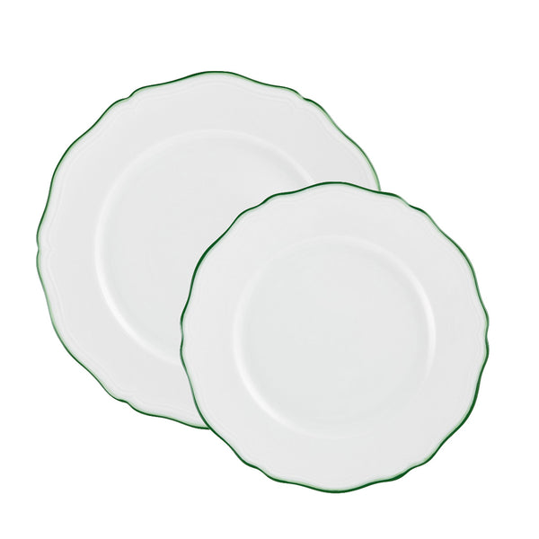 Two exquisite ceramic plates from the Raynaud Touraine Green Trim Collection, one larger and one smaller, with scalloped edges and green rims, are stacked together—an exemplary illustration of Raynaud’s poetic porcelain, meticulously hand-painted to perfection.