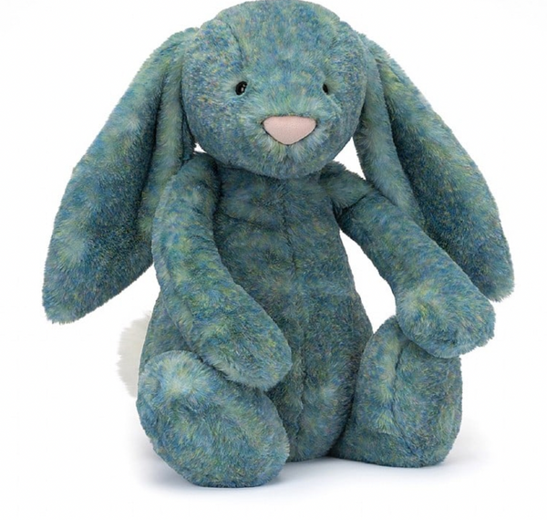 A plush, teal-colored stuffed rabbit sits upright with long ears, a pink nose, and soft fur. This Jellycat Bashful Luxe Bunny Azure, Huge is a delightful addition to any collection.