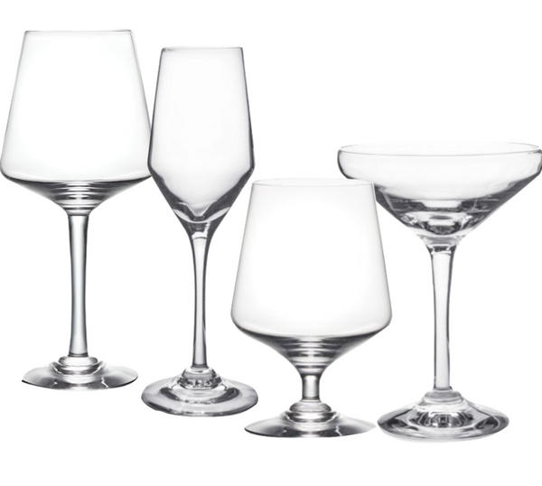 A set of four different types of empty wine glasses lined up side by side: Bordeaux, champagne flute, white wine, and cocktail coupe. Crafted from exquisite handblown glass, the Simon Pearce Vintner Collection vessels embody the elegance appreciated by Napa Valley winemakers.