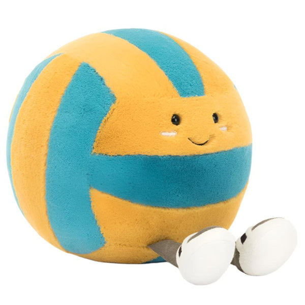 A volleyball-shaped plush toy from Jellycat, part of the Amuseables Sports Beach Volley collection, showcasing a smiling face with a blue and yellow design and small feet adorned with textured sandals.