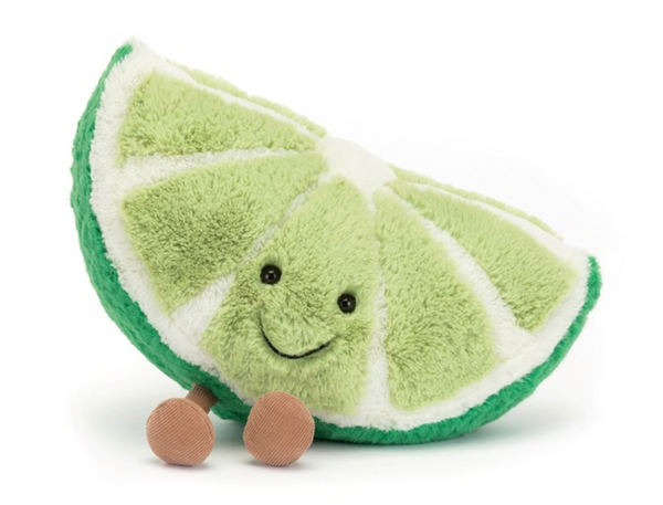 A plush toy shaped like a smiling lime wedge with two small brown feet, the Jellycat Amuseables Slice of Lime is a fun-loving fruit and the perfect zesty companion.