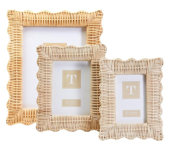 The Two's Company Wicker Weave Scalloped Frame Collection features three hand-woven photo frames in varying sizes, made of wicker weave rattan and placed against a white background—perfect for enhancing neutral décor.