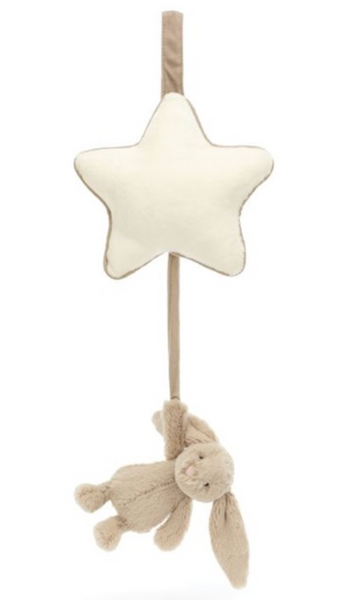 A Jellycat Bashful Beige Bunny Musical Pull features a cream-colored star at the top and a light brown Bashful Silver Bunny hanging below on a beige strap.