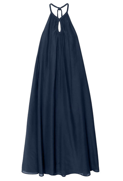 A sleeveless, dark blue halter maxi dress with a keyhole detail at the neckline, featuring a braided trim for added elegance, the Xirena Drue Dress by Xirena.