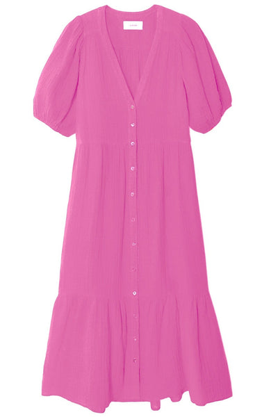 A pink mid-length Xirena Lennox dress with short sleeves, a button-up front, and a ruffled hem.