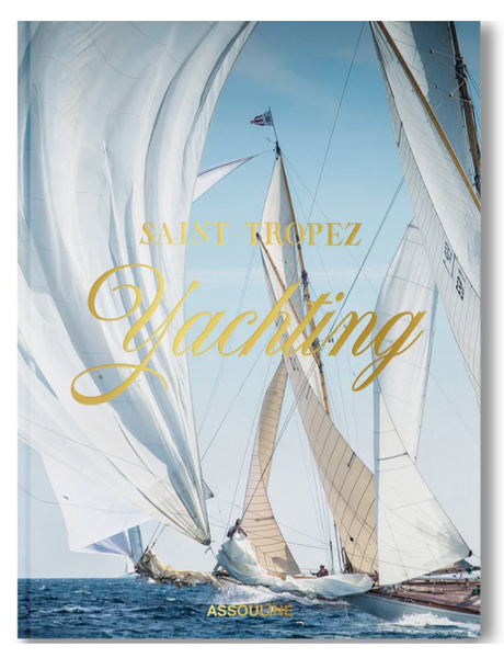 The cover of Assouline's "Saint Tropez Yachting" showcases a stunning scene of two sailboats racing in the Voiles de Saint-Tropez beneath a clear Mediterranean sky.