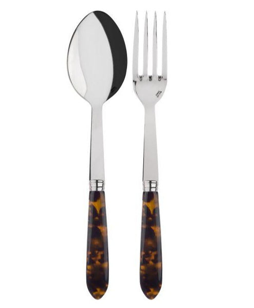 A Sabre Tortoise Serving Set by Sabre, featuring dark tortoiseshell-patterned acrylic handles and shiny stainless steel heads, is placed side by side against a white background.