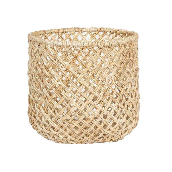 The Pigeon & Poodle Kearny Bleached Round Basket is a large, cylindrical basket made from woven wicker and features an open lattice pattern.