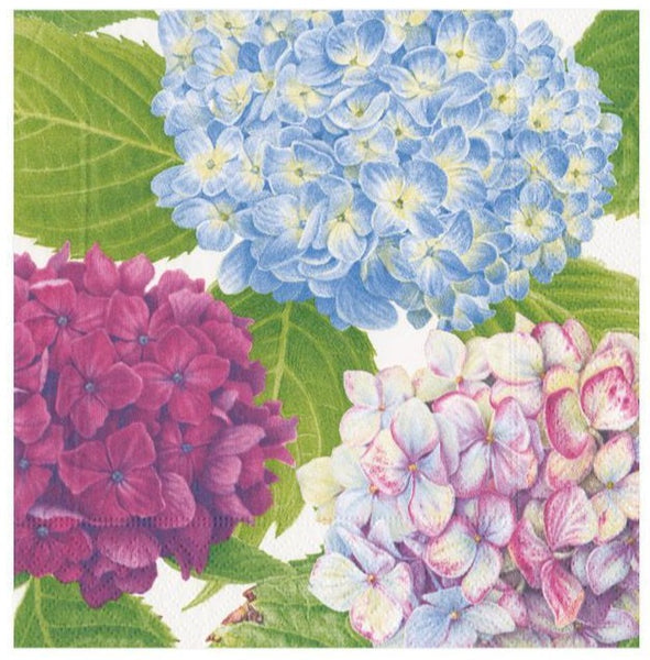 A close-up of a Caspari Hydrangea Garden Blue cocktail napkin, an eco-friendly option.