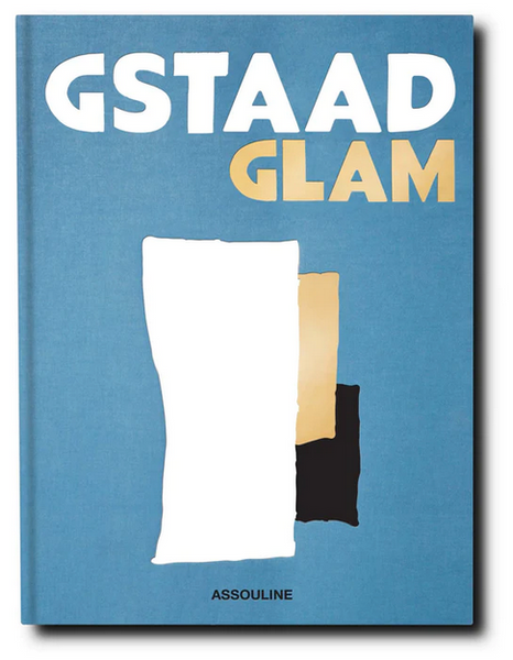 Cover of the book Gstaad Glam by Assouline, featuring abstract shapes in white, beige, and black on a blue background, exuding an Alpine chic vibe reminiscent of the Swiss Alps.