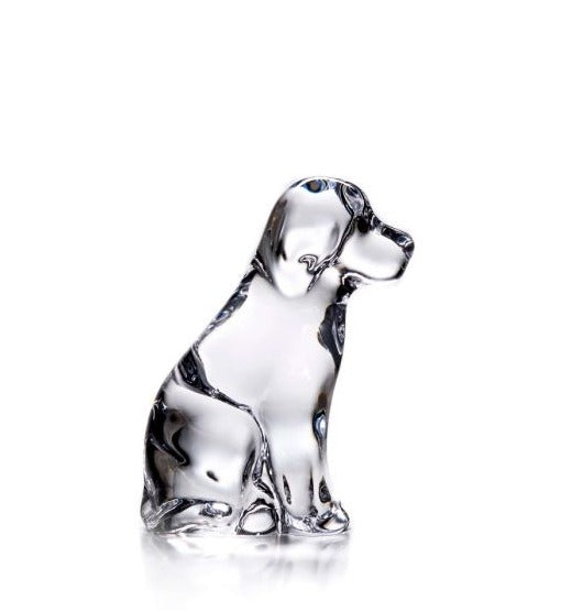 The Simon Pearce Glass Dog, 4", beautifully captures the essence of canine companionship with its clear glass depiction of a sitting dog.