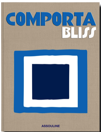 A book cover titled "Comporta Bliss" featuring abstract blue and white geometric shapes, reminiscent of the artistic community and beaches of Comporta. The publisher's name, Assouline, is at the bottom.