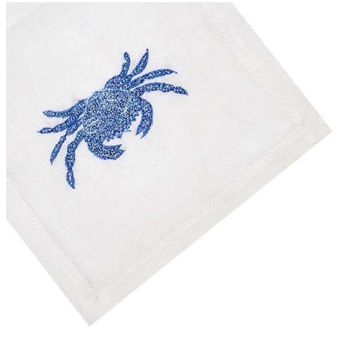 Set of 4 white coasters from Haute Home featuring a charming blue hand-embroidered crab design in the corner.