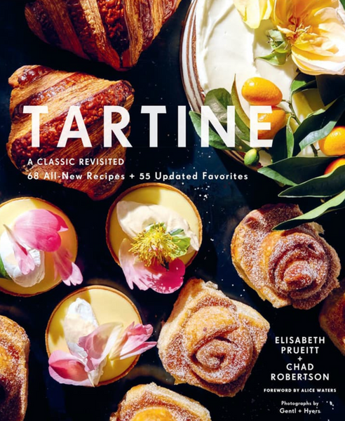 Cover of the bakery book "Tartine: A Classic Revisited" featuring a variety of pastries and desserts, including the famed Morning Bun, with authors Elisabeth Prueitt and Chad Robertson mentioned below the title, published by Chronicle Books.