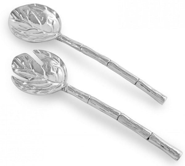 Two silver salad servers with textured handles and leaf-shaped heads, one spoon and one fork. Perfect as a birthday gift for a cook. The Beatriz Ball Garden Salad Servers by Beatriz Ball are an elegant addition to any kitchen.