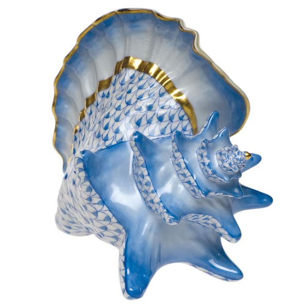 A Herend Conch Shell, Blue on a white background.