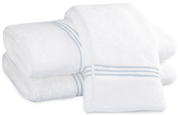 Three neatly folded luxury towels from the Matouk Bel Tempo Bath Collection, made by Matouk from premium Cairo cotton, featuring elegant blue stripes, displayed in a stack and OEKO-TEX certified for your peace of mind.