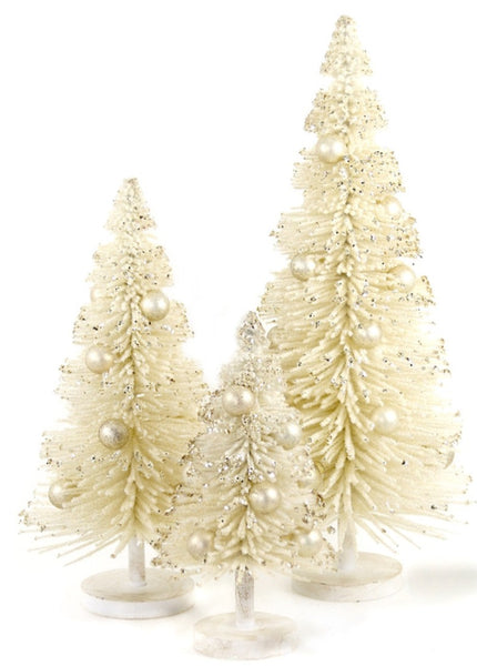 Three cream-colored decorative Christmas trees, available for purchase separately, feature glitter and pearl-like ornaments. Each snow-laden tree is of a different height and comes with a round base. The medium-sized option, Cody Foster Snow Laden Tree at 11", is the perfect addition to any festive setting.