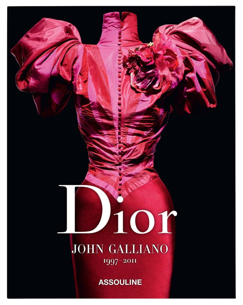 Cover of the book "Dior V by Galliano" by Assouline, featuring a vibrant red haute couture dress with elaborate sleeves and floral embellishments on a black background.