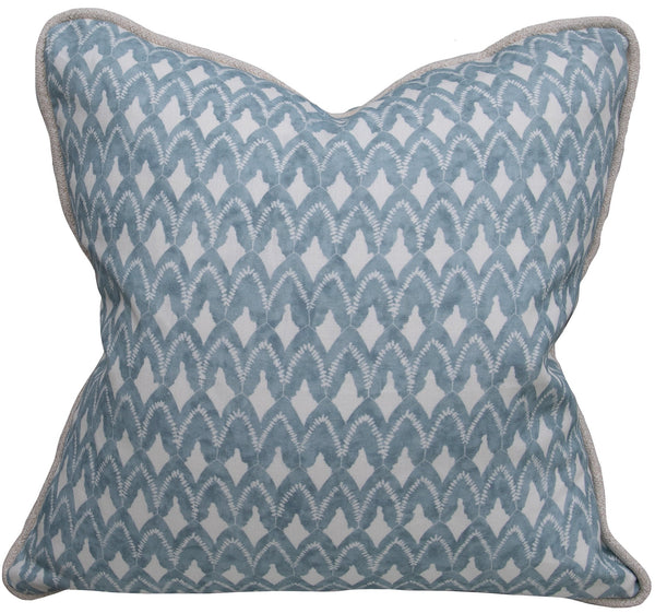 The Bluebird Arrowhead Relief Pillow by Associated Design is a handmade square throw pillow featuring a blue and white chevron pattern. It is elegantly finished with light gray trim along the edges. This custom down-filled pillow is proudly made in the USA.