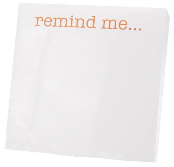 The Black Ink Small Paddie, Remind Me, showcases "remind me..." in bold orange text on a white background and is elegantly housed in a Lucite Notepad Holder, crafted from high-quality paper to add a sophisticated touch.