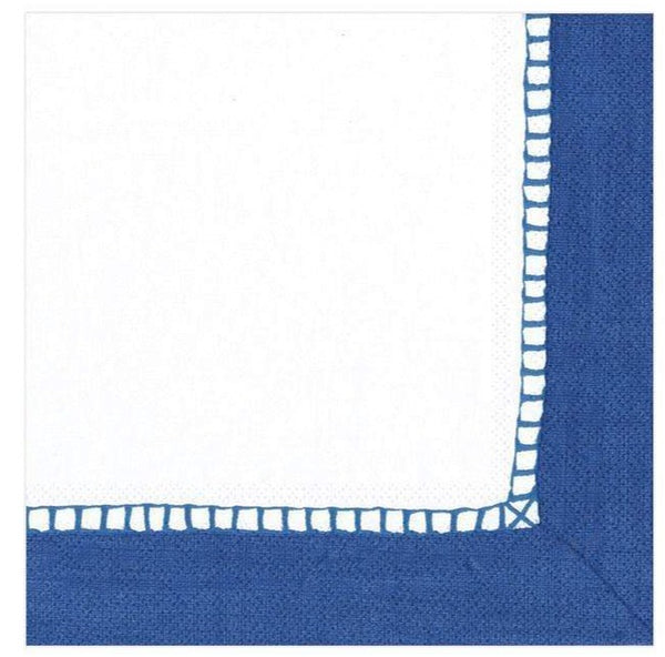 A Caspari Linen Border Marine Blue cocktail napkin with white trim, measuring 5" x 5".