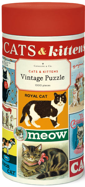 A cylindrical tin labeled "Cavallini & Co. Cats and Kittens 1,000 Piece Puzzle" contains a delightful puzzle from Cavallini Papers and Co's archives, featuring charming cat illustrations along with the words "meow" and "Royal Cat.