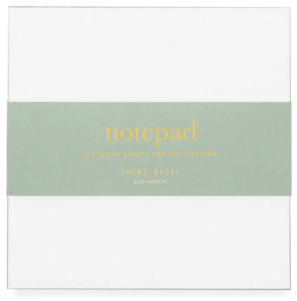 The Sugar Paper Painted Pad, Green, is a notepad featuring 150 blank sheets, ideal for on-the-go notes. It comes wrapped in a green paper band with "notepad" and "Sugar Paper Los Angeles" printed on it.