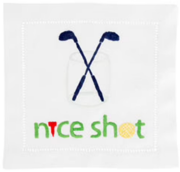 August Morgan white linen napkin with embroidered crossed golf clubs, a golf ball, and the phrase "nice shot" in colorful letters.