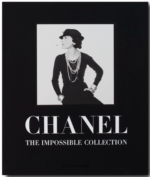 Book cover featuring a black and white image of a stylishly dressed woman wearing a hat and layered necklaces. The cover reads, "The Impossible Collection of Chanel," published by Assouline, capturing the essence of Gabrielle Chanel's influence on contemporary fashion through luxe minimalism.