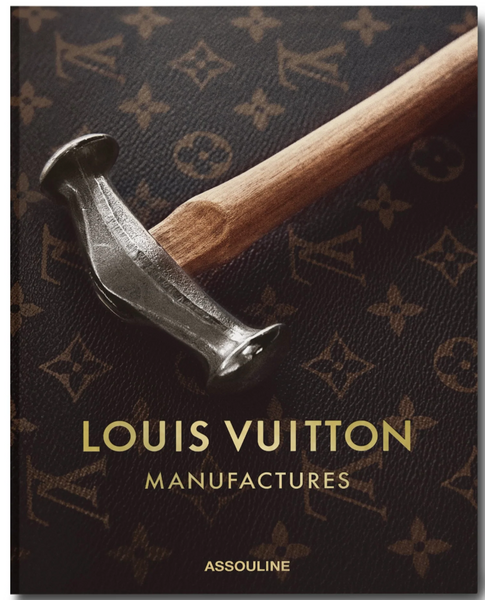 A hammer resting on an atelier-inspired Assouline patterned book cover.