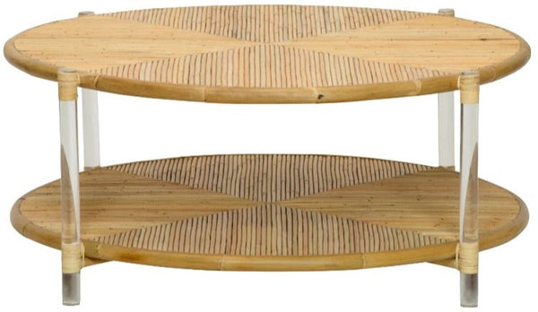 The Sea Cliff Coffee Table by Selamat is a round, two-tiered wooden table with a woven pattern, measuring 46"W x 18.7"D x 34"H. It features clear acrylic legs and a natural finish.